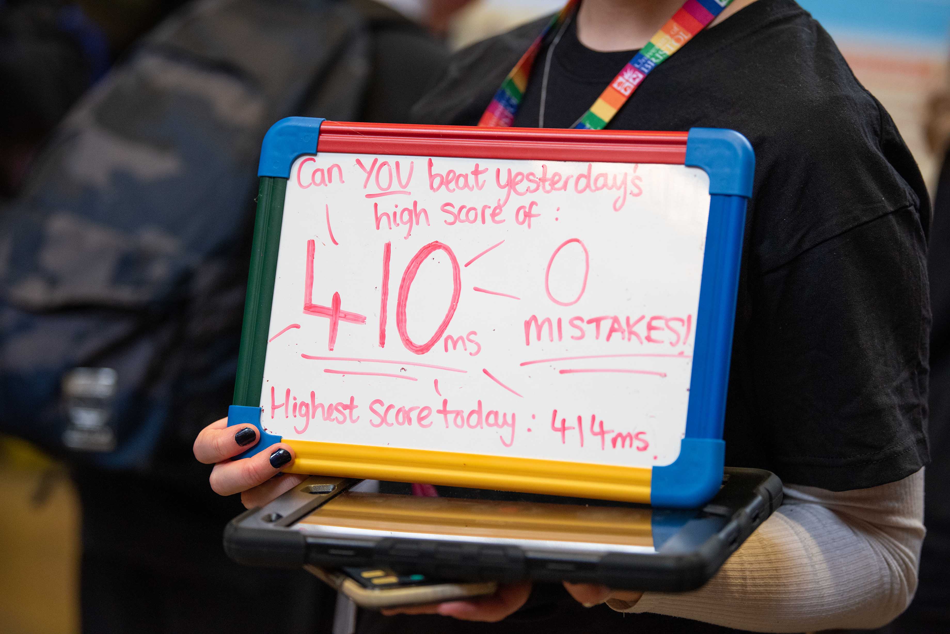 Highest score to beat sign at one of the experiment stalls
